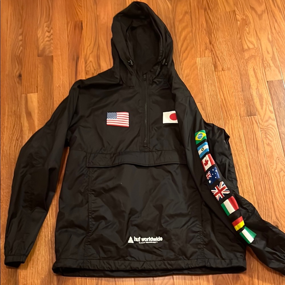 HUF Black Raincoat with Flag Patches